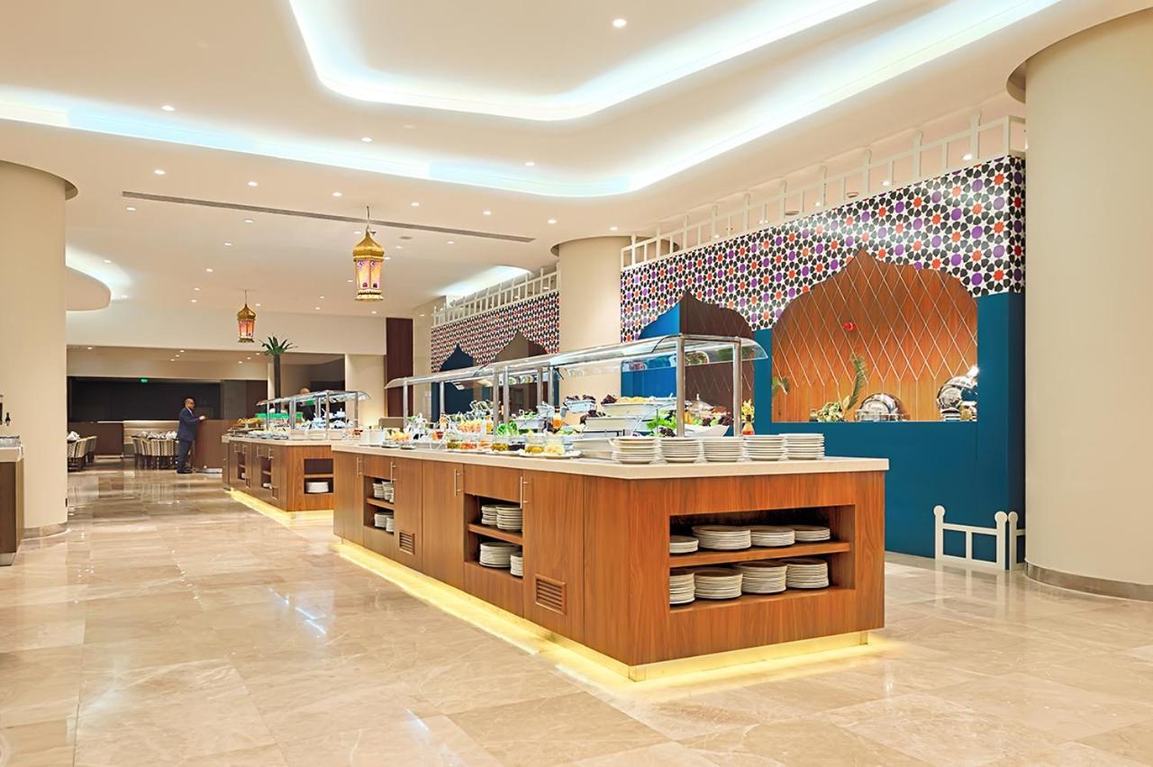 Holiday Suites Al Azizia Мекка Экстерьер фото The hotel's restaurant